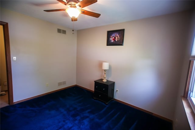 unfurnished room featuring carpet flooring and ceiling fan