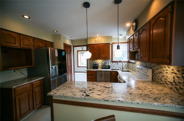 kitchen with kitchen peninsula, tasteful backsplash, electric range, stainless steel dishwasher, and pendant lighting