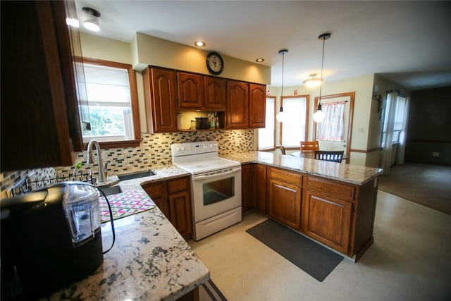 kitchen with decorative light fixtures, white electric range oven, light stone counters, and tasteful backsplash