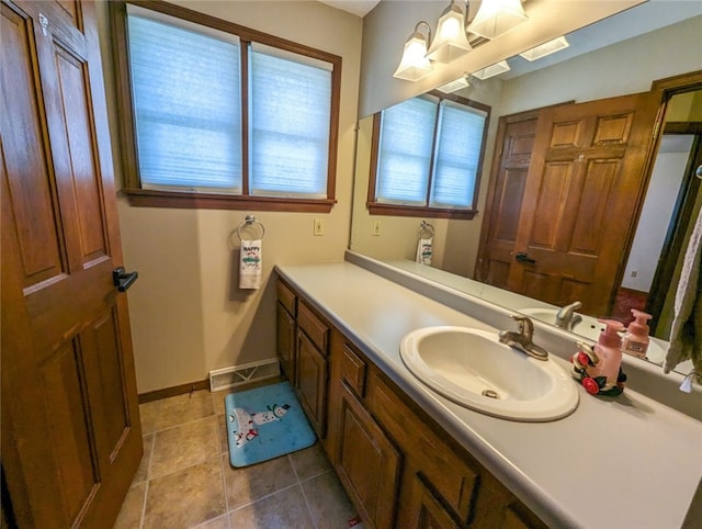 bathroom featuring vanity with extensive cabinet space and tile floors