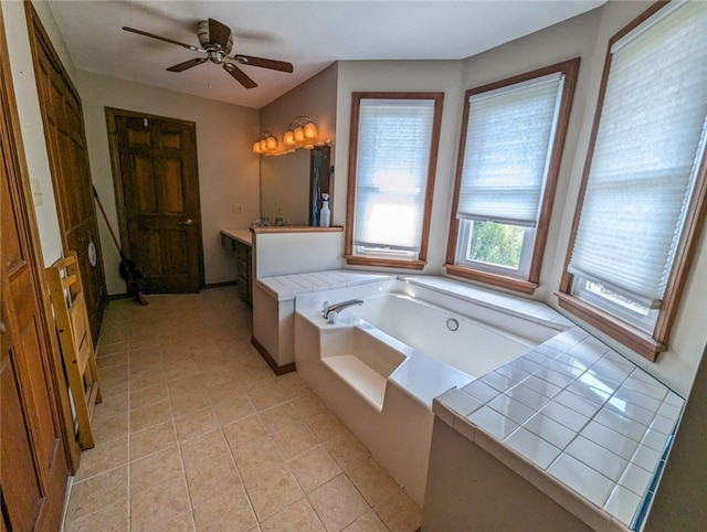 bathroom with a bath, tile floors, vanity, and ceiling fan