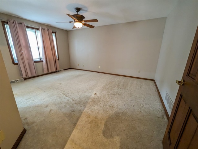 carpeted empty room with ceiling fan