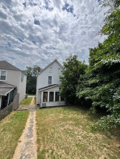 613 Center St, Versailles Boro, PA 15132 - view of front facade featuring a front yard