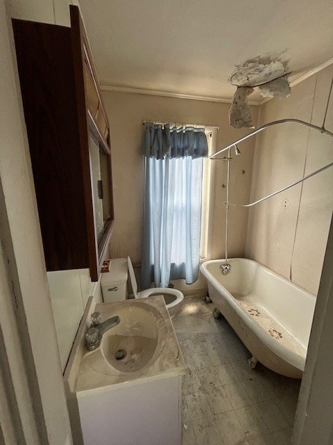 bathroom featuring sink, tile flooring, and toilet