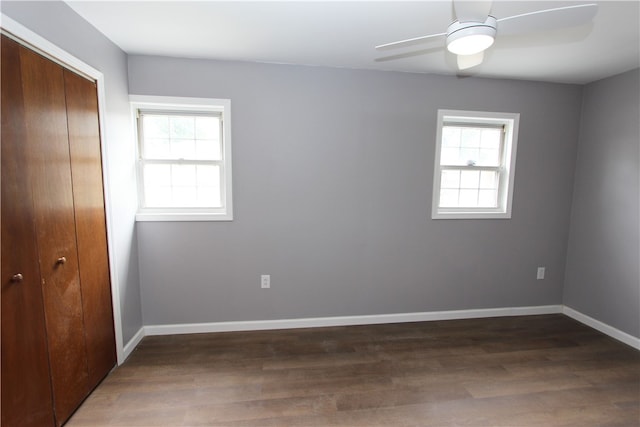 spare room featuring hardwood / wood-style flooring, plenty of natural light, and ceiling fan