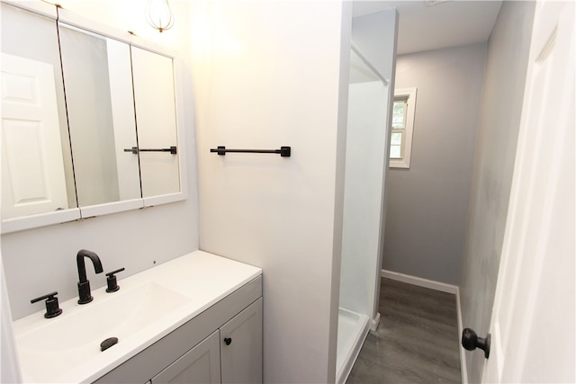 bathroom featuring vanity and wood-type flooring