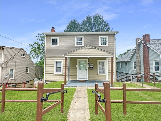 view of front of property featuring a porch and a front lawn