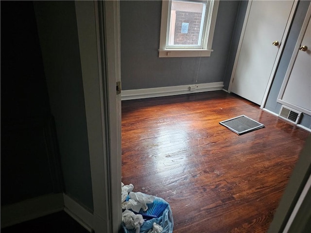 spare room featuring hardwood / wood-style flooring