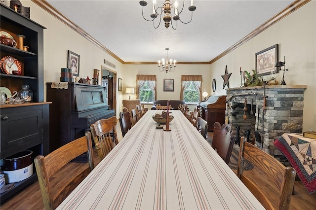 dining space featuring hardwood / wood-style flooring, built in shelves, crown molding, and a chandelier