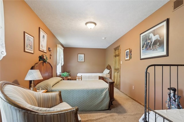 carpeted bedroom featuring a textured ceiling