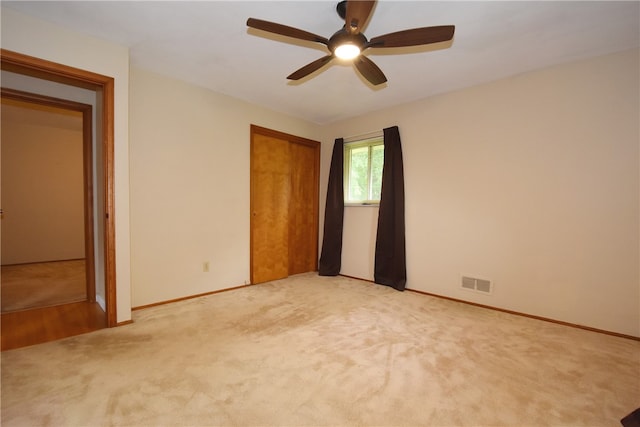 unfurnished bedroom featuring hardwood / wood-style floors and ceiling fan