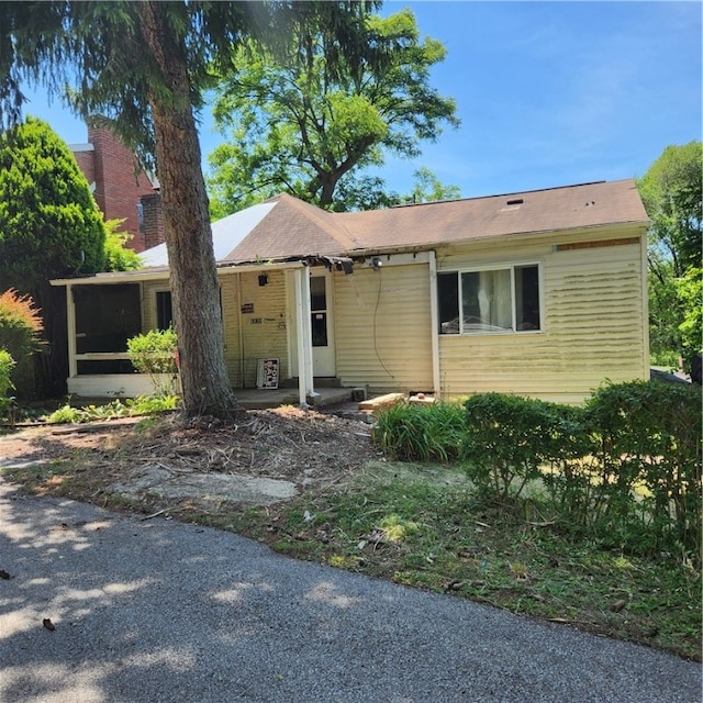 view of front of property with a sunroom