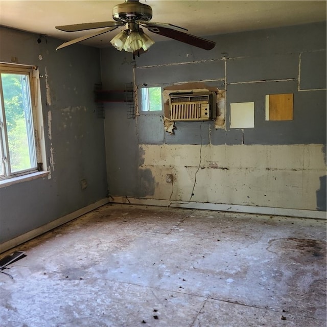 empty room featuring concrete floors and ceiling fan