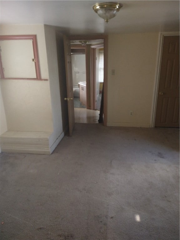 unfurnished bedroom with carpet floors