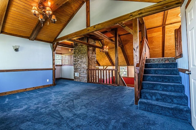 interior space featuring vaulted ceiling with beams, carpet, and wooden ceiling