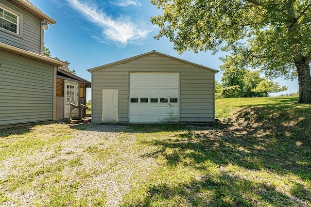 garage featuring a yard