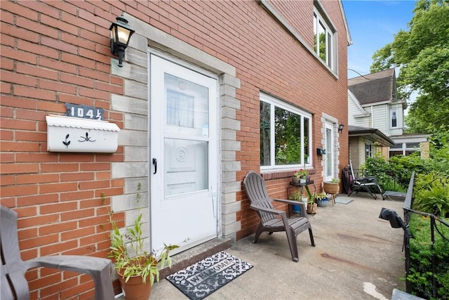 property entrance featuring a patio