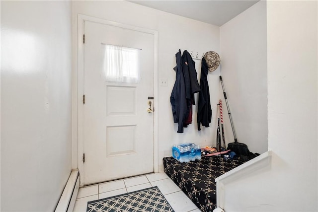 mudroom with light tile patterned floors and baseboard heating