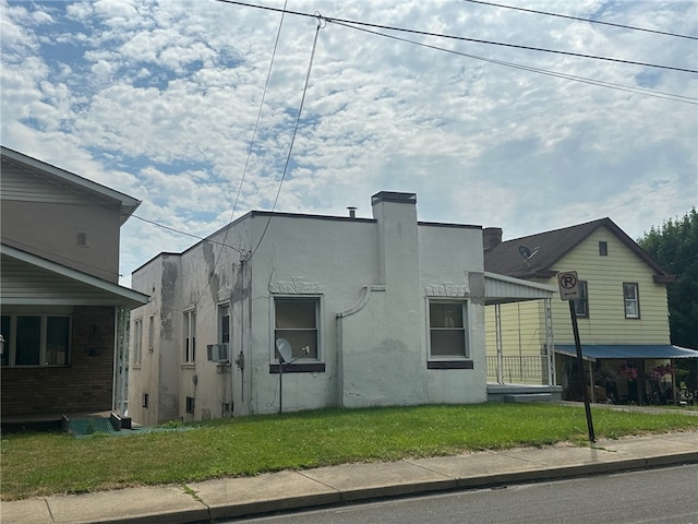 view of property exterior with a lawn