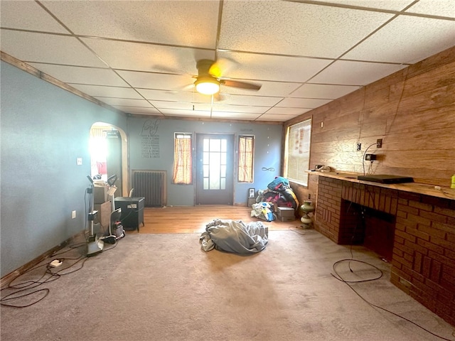 misc room with carpet, ceiling fan, and a paneled ceiling