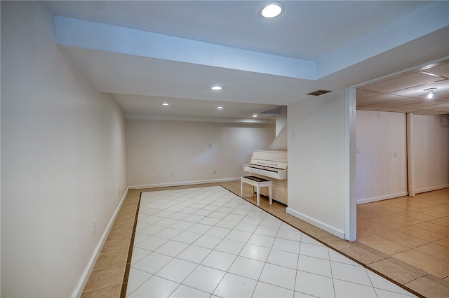 basement with light tile patterned floors