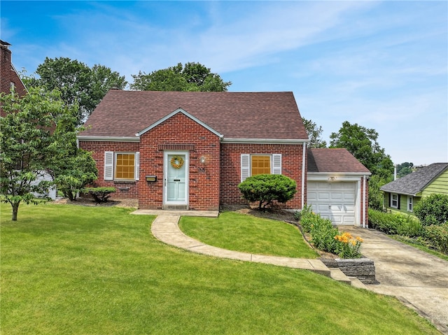 view of front of property featuring a front yard and a garage