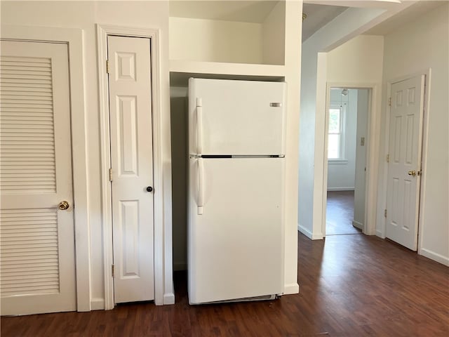 interior space with dark wood-type flooring and white refrigerator