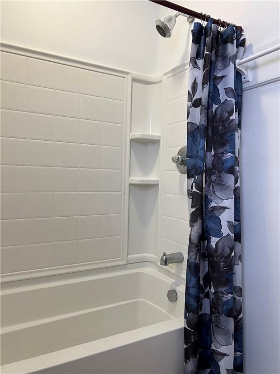 bathroom featuring shower / bath combination with curtain