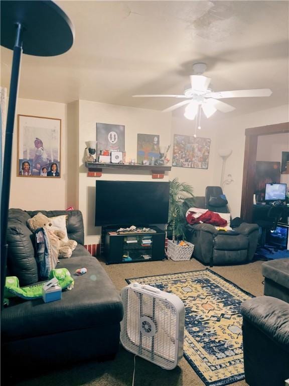 living room featuring carpet floors and ceiling fan