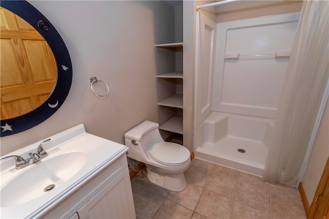 bathroom featuring walk in shower, vanity, and toilet