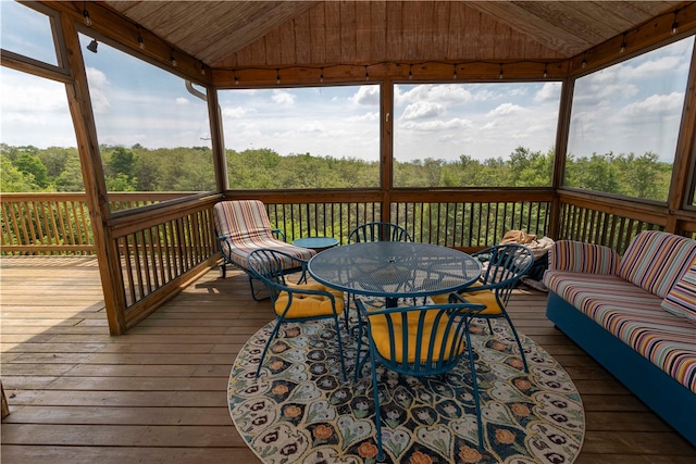 wooden terrace with a gazebo and an outdoor hangout area