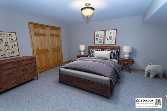 carpeted bedroom with a closet