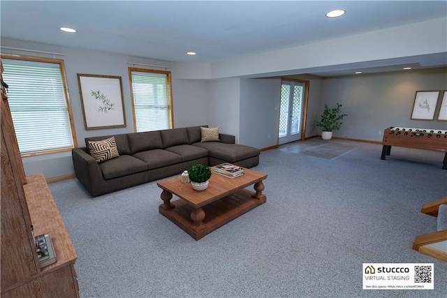 carpeted living room featuring a wealth of natural light