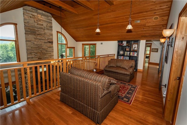 living room featuring hardwood / wood-style flooring, lofted ceiling, and wooden ceiling