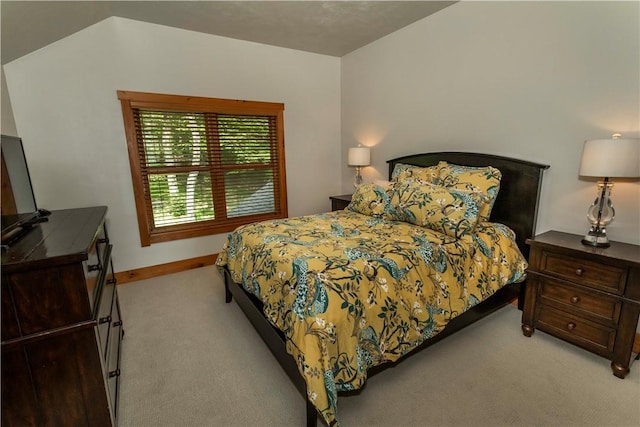 bedroom featuring light colored carpet