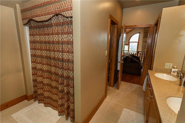 bathroom featuring tile patterned flooring and vanity