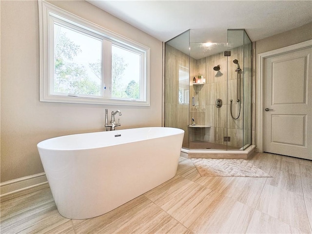 bathroom with separate shower and tub