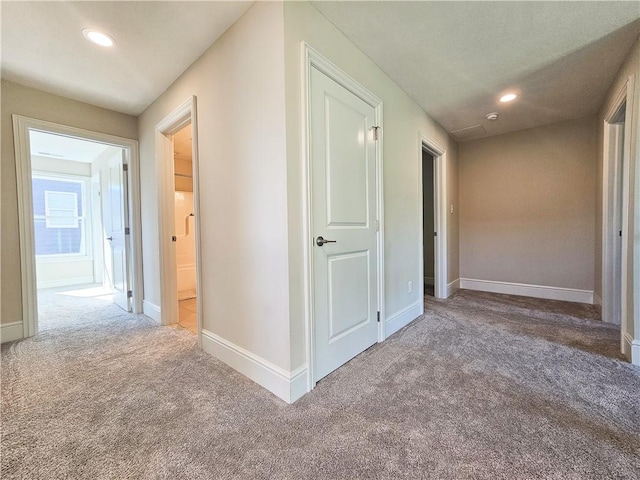 hallway with carpet flooring