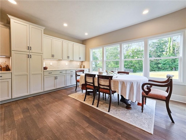 dining room with dark wood-type flooring