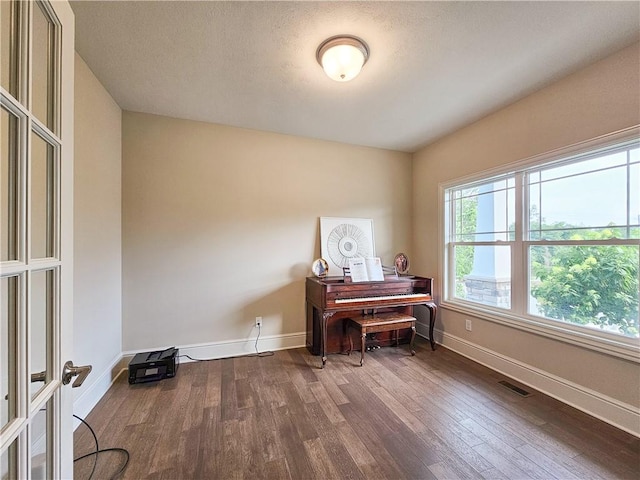 miscellaneous room featuring wood-type flooring