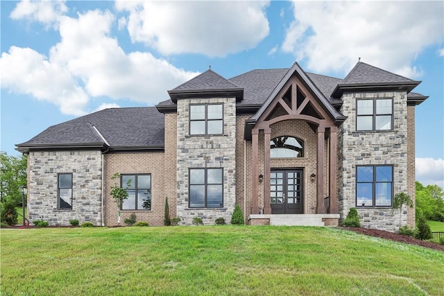 view of front of house with french doors and a front lawn