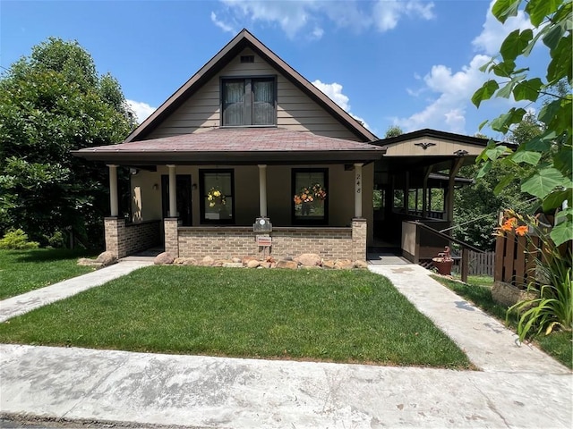 view of front facade with a porch and a front lawn