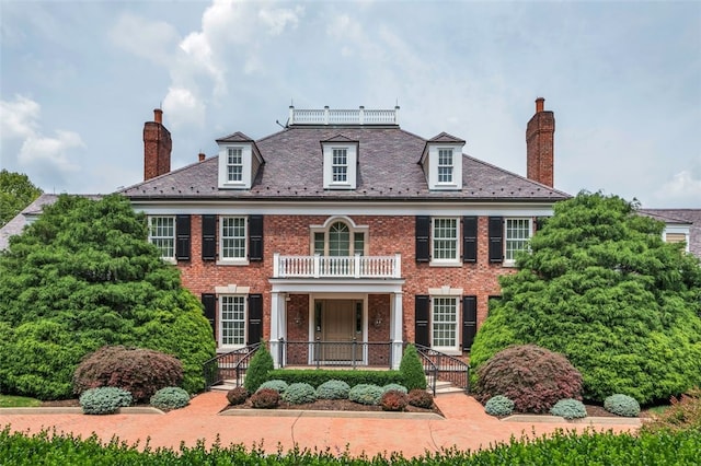 colonial home with a balcony