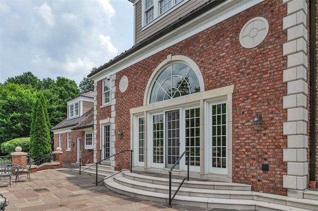 doorway to property with french doors and a patio