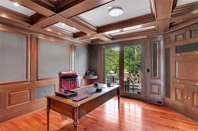 office space featuring crown molding, light hardwood / wood-style flooring, beamed ceiling, and coffered ceiling