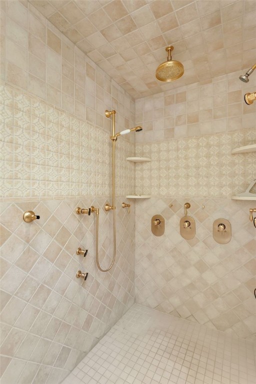 bathroom with tiled shower