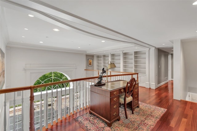 office area with crown molding, built in features, and dark wood-type flooring