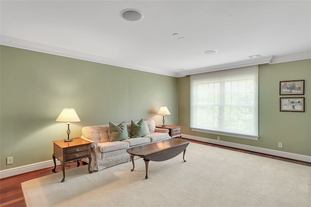 living room with hardwood / wood-style flooring and ornamental molding