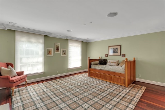 bedroom with hardwood / wood-style floors and ornamental molding