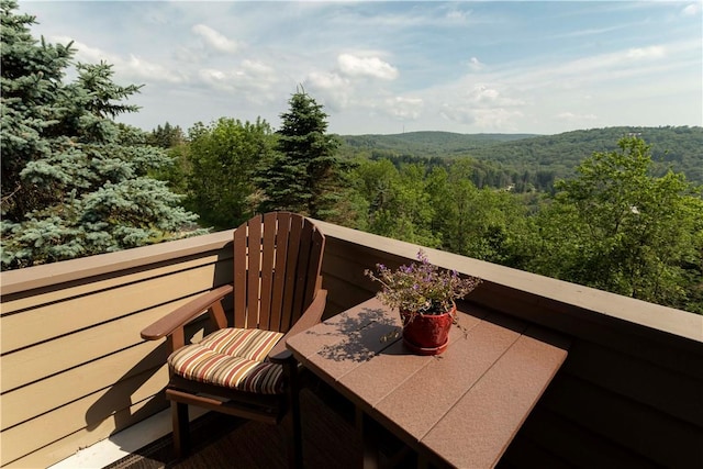 balcony with a forest view